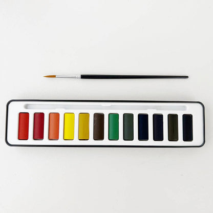 Watercolor paint with brush
