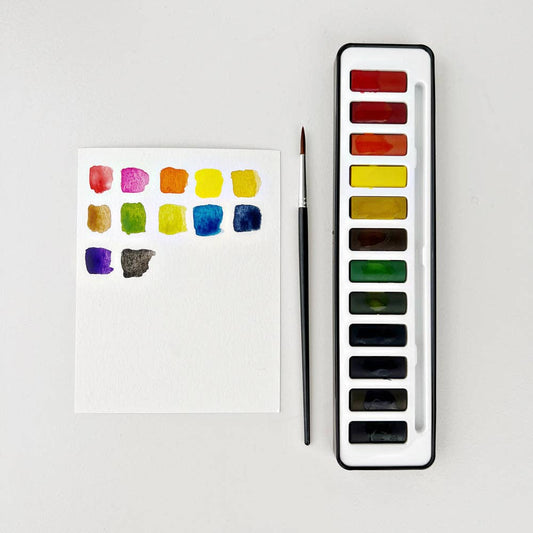 Watercolor paint with brush